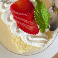 Tres Leches Cake · Sweet sponge cake soaked in three kinds of milk and topped with whipped cream.