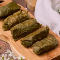 Tolma · Tolma - 10 marinated grape leaves stuffed with ground pork, rice and Georgian spices. Served...