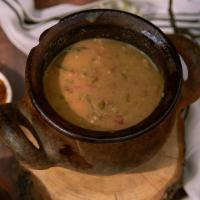 Lobio Kotanshi · Kidney beans stewed, served on simmering clay pot with corn bread, pickled vegetable and gre...
