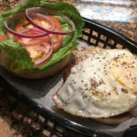 Fried Egg Cheeseburger · American cheese and a fried egg over our house hamburger. The burger is 100% Angus beef. Ser...