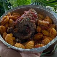 Beef Braciola · Stuffed with pork sausage, plum tomatoes over gnocchi.
