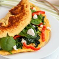 Florentine Omelette · Fluffy omelette with feta cheese and spinach.