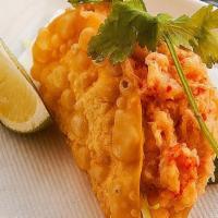 Lobster Taco · Crisped wonton skin, crawfish salad, tobiko roe, yuzu cabbage slaw,  cilantro.