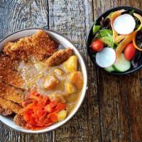 Curry Katsu · Fried panko breaded pork chop, chef special curry, carrot, and potato over steamed rice. Com...