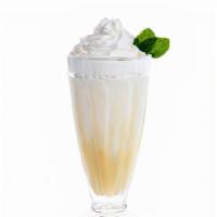 Black & White Milkshake · Vanilla & Chocolate swirled milkshake topped with whipped cream.