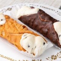 Cannoli Large · Vanilla cake with cannoli filling and icing with crushed cannoli shells.