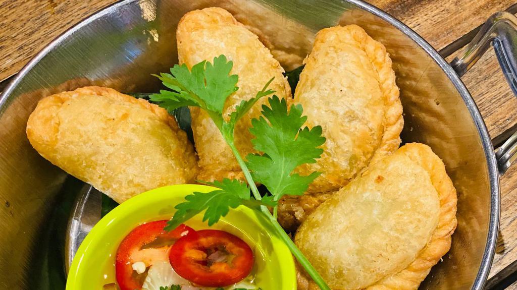 Curry Puffs · Minced chicken, potato, mixed peas & carrot, onion in puff pastry serve with cucumber vinaigrette dip.