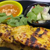 Chicken Satay · Grilled marinated chicken tenders on skewers, served with peanut sauce & cucumber vinaigrett...
