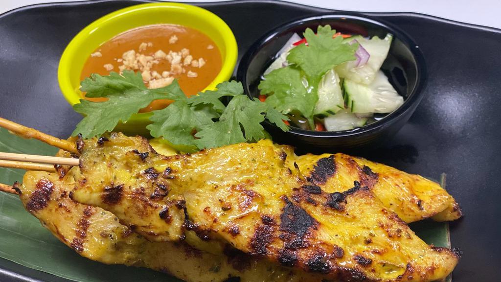 Chicken Satay · Grilled marinated chicken tenders on skewers, served with peanut sauce & cucumber vinaigrette dip.