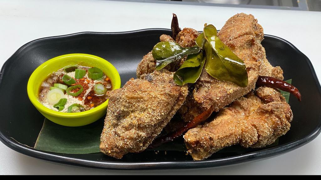 Wing Zaab · Spicy. Fried spicy crispy chicken wings e-sarn style with spicy tamarind sauce.