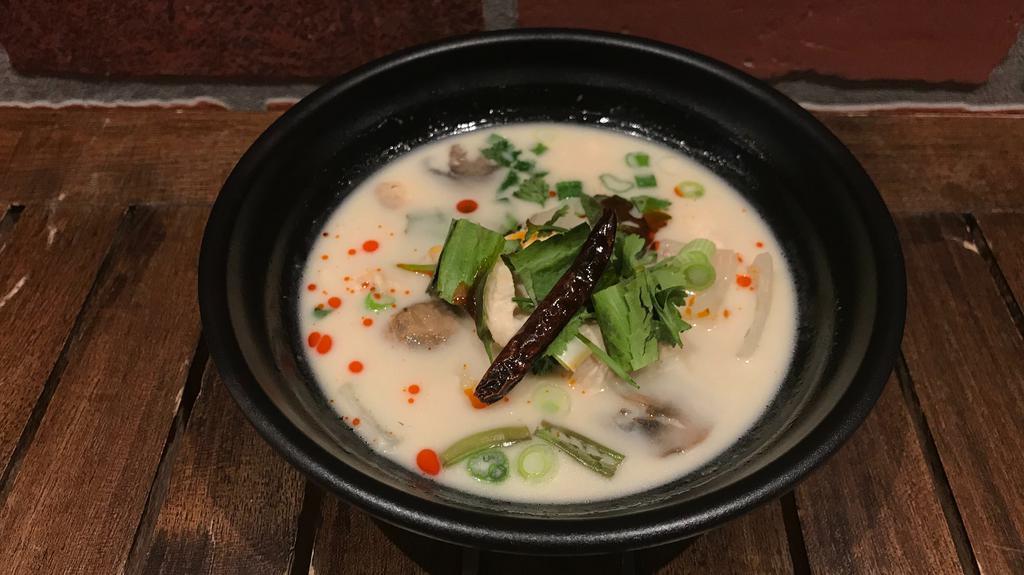 Tom Kha Soup · Gluten-free. Choice of chicken or vegetables. Aromatic & mildly spiced with mushroom, dry chili & onion with a broth that’s rich in coconut milk.