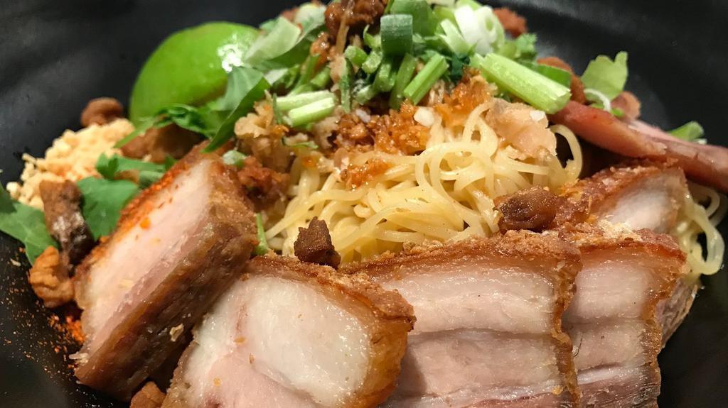 Ba Mee Moo Moo Daeng & Moo Krob · Boiled egg noodle topped with roasted pork, crispy pork belly, peanut, lime, preserved cabbage, cilantro, celery, scallion, served with clear broth soup on the side.