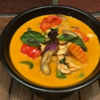 Red Curry · Spicy. Red curry paste, bamboo shoot, eggplant, carrot, bell pepper & basil in coconut milk,...