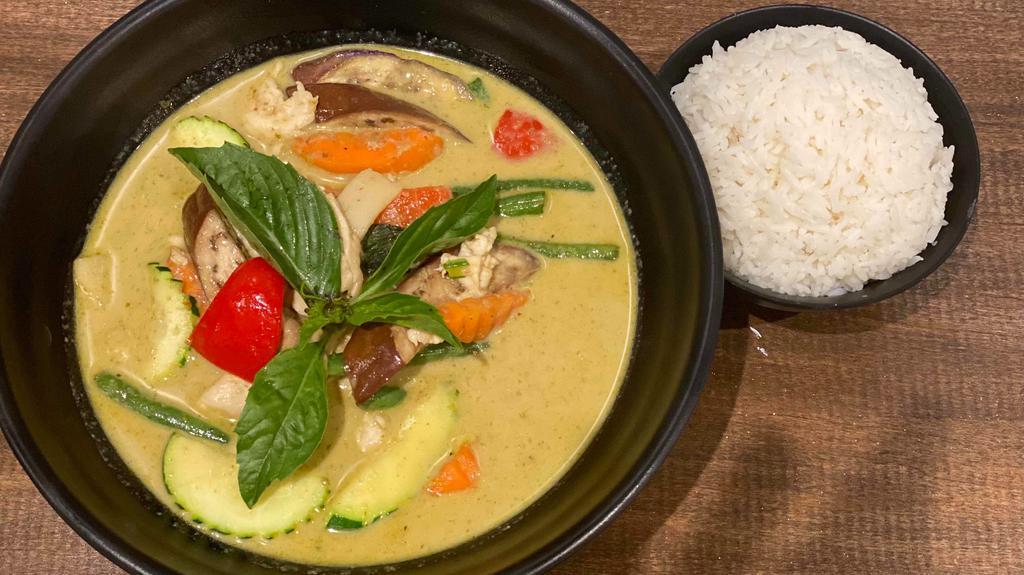Green Curry · Spicy. Green curry paste, bamboo shoot, string bean, eggplant, basil, zucchini, carrot & bell pepper in coconut milk.