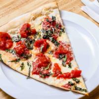 Margherita Pizza · Fresh plum tomatoes, fresh mozzarella, and basil on a thin crust topped with olive oil and g...