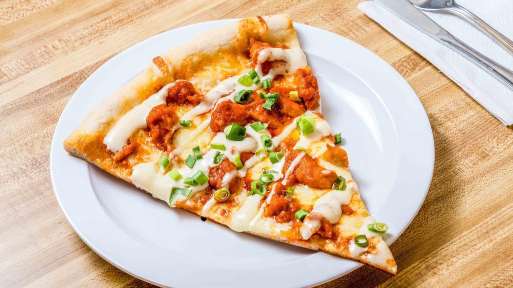 Buffalo Chicken Pizza · Tender pieces of spicy buffalo chicken baked on top of our homemade blue cheese dressing, topped with mozzarella cheese.