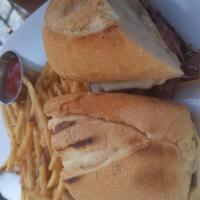 Chat Steak Sandwich With Homemade Potato Chips · Sauteed onions and mushrooms with milled Swiss.