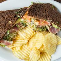Grilled Tuna Sandwich With Homemade Potato Chips · Fresh tuna, wasabi mayo, avocado, tomato, alfalfa sprouts on pumpernickel.