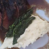 Sliced Steak · Sauteed spinach and whipped potatoes, port wine reduction.