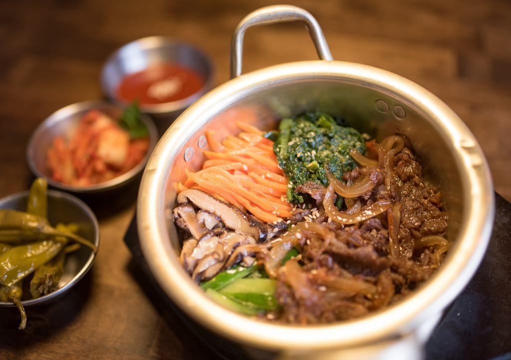 Bulgogi Bowl · Traditional Korean bulgogi (beef) with sautéed shiitake mushroom, spinach, zucchini, carrot served over white rice. Comes with gochujang sauce and kimchi.