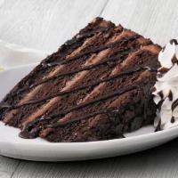 New! Chocolate Overload Cake  · Four rich, dark chocolate, melt-in-your-mouth cake layers stacked high with sweet milk choco...