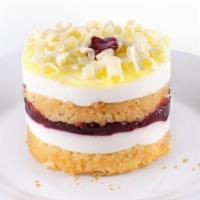 New! Raspberry Lemon Drop  · Light & refreshing! Yellow sponge cake is layered with lemon mousse and thick raspberry pres...