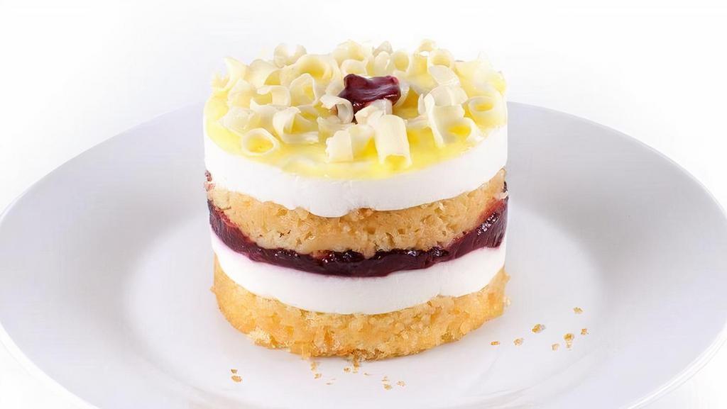 New! Raspberry Lemon Drop  · Light & refreshing! Yellow sponge cake is layered with lemon mousse and thick raspberry preserves. Finished with a bright lemon glaze and mini white chocolate curls. 550 calories.