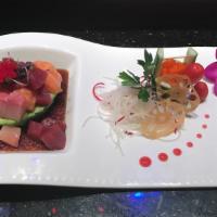 Fantastic Island · Tuna, salmon, yellowtail and masago on avocado with wasabi yuzu sauce.