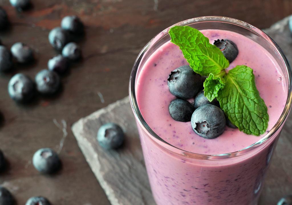 Blueberry Powerup Smoothie · Super rich and protein packed vanilla almond smoothie. with almond milk, Ono apple banana, chia seeds, almond butter, maca, and vanilla Sun Warrior protein & blueberries