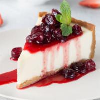 Cherry Cheesecake · Classic cheesecake with a rich, dense, smooth, and creamy consistency, topped with a delicio...