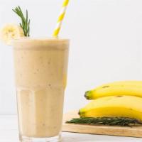 Banana Milkshake · Banana milkshake topped with whipped cream.