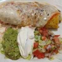 Burrito · Round rolled flour tortilla stuffed with your choice of meat or vegetables, topped with chee...