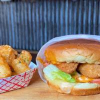 Spicy Crispy Chicken Sandwich · A crispy chicken tender on a brioche bun with lettuce, cucumber, tomato, Swiss Cheese and ou...