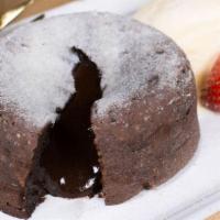 Lava Cake · Chocolate lava cake with our spiced whipped cream and berries