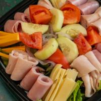 Chef Salad · Fresh romaine lettuce, spring mix, oven gold turkey Breast, boiled Ham, and Swiss and Americ...