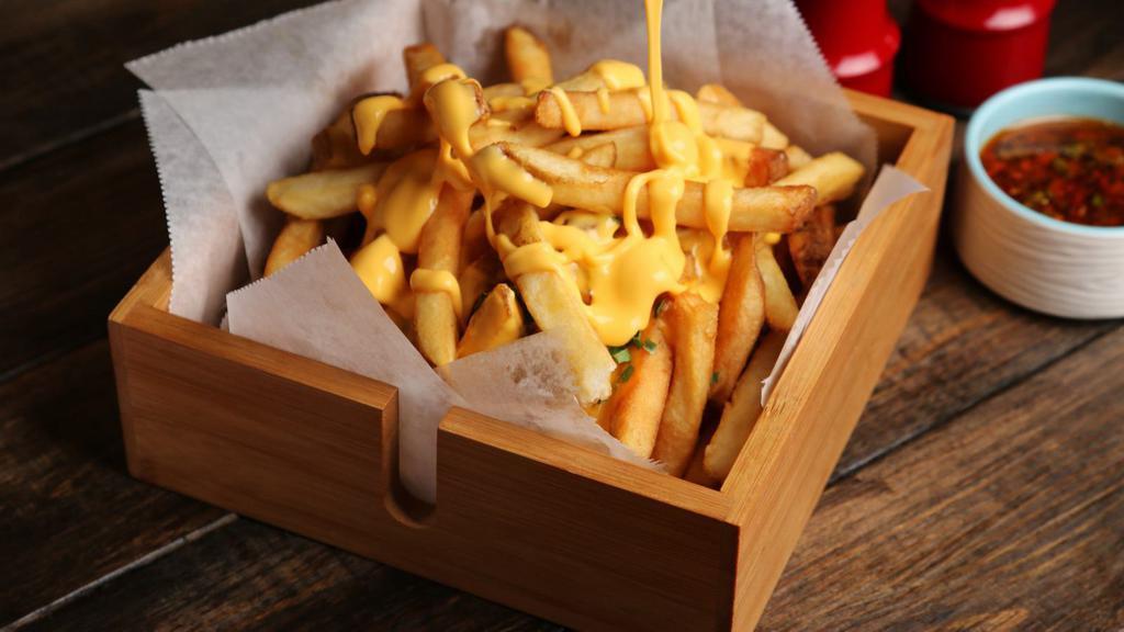 Cheese Fries · Fresh hand cut potatoes with melted cheese.