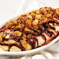 Banana Split · Served with three scoops ice cream, topped with whipped cream, roasted nuts and syrup