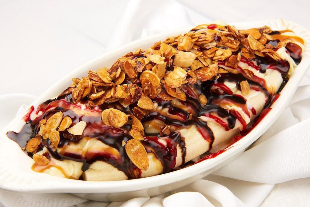 Banana Split · Served with three scoops ice cream, topped with whipped cream, roasted nuts and syrup