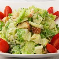 Caesar Salad · Crispy romaine lettuce, croutons, cherry tomatoes, and Parmesan cheese served with our homem...