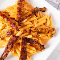 Penne Vodka W/Chicken · Homemade penne vodka sauce over penne pasta with fresh grilled chicken