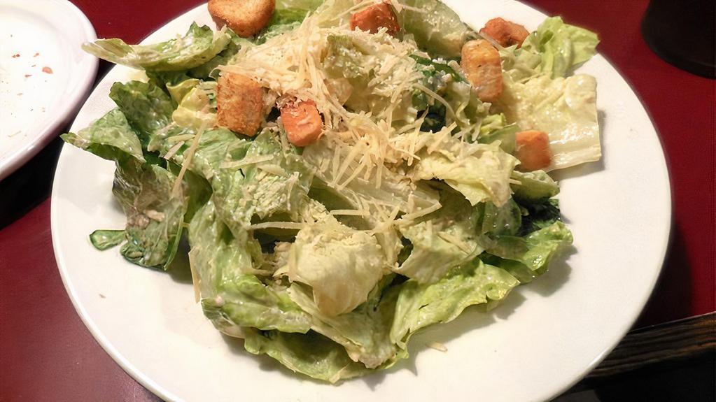 Caesar Salad · Romaine lettuce with tomatoe, onions, grated cheese and caesar dressing