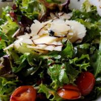House Salad · Mixed greens with fresh tomatoes and onions