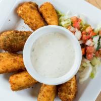 Jalapeño Poppers · Cream cheese stuffed jalapeño poppers, dipped in spicy breading, and fried until golden crisp.