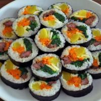 Kim-Bob · Korean style roll wrapped in dry seaweed(carrots, lettuce, pickled radish, ham and beef.