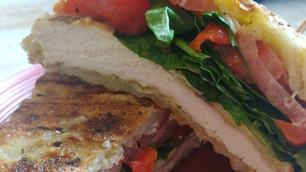 Lemon Pesto Grilled Chicken · Grilled chicken, lemon pesto mayo, melted Mozzarella, roasted red peppers, red onion, and fresh spinach served on scratch-baked focaccia bread.