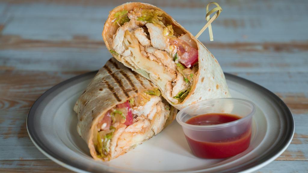 The Winger · A hot buffalo grilled chicken wrap with gorgonzola cheese crumbles, melted swiss, lettuce, and tomato on a multi-grain wrap.