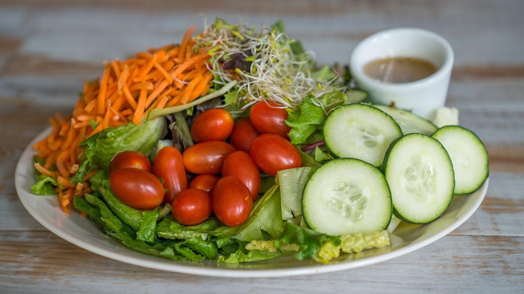 Garden Grab · Romaine lettuce, mixed greens, cucumbers, sprouts, grape tomato, black olives and shredded carrot.