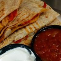Chicken Quesadilla · Sliced chicken breast, shredded cheddar cheese, sautéed roasted red peppers and onions serve...