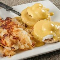 Eggs Benedict · Two poached eggs and Canadian bacon on a split English muffin, topped with hollandaise sauce...