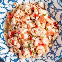 Seafood Salad · Shrimps, squid, crabmeat with vegetables marinated in lime juice and olive oil. Served  as a...